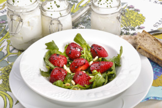 Swabian cuisine, Luggeles cheese in a jar, salad rocket with strawberries, pine nuts, Swabian cream