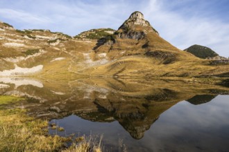Lake Augstsee and the Atterkogel mountain on the Loser. Autumn, good weather, blue sky. Reflection.