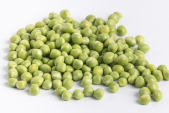 Close-up of a pile of fresh green peas (Pisum sativum) on a white background