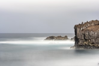 Angler on the beach and rocks, surf on Lanzarote, Spain, Europe