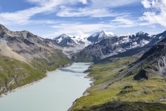 Picturesque mountain landscape, view of a blue mountain lake, Lac des Dix reservoir, behind