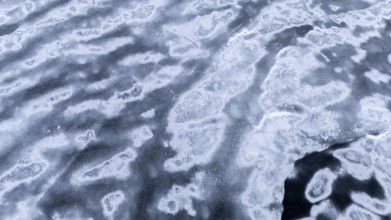 Frozen lake in early winter. Region of La Mauricie. Province of Quebec. Canada