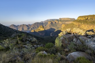 Sunset at Blyde River Canyon with Three Rondawels peak, view of canyon with Blyde River and Mesa