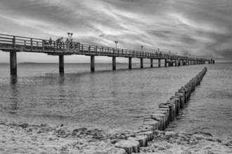Baltic Sea beach, Baltic Sea coast with the Graal-Müritz pier, sunset, evening mood, black and