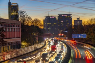 Evening traffic, partly with traffic jams, slow-moving traffic on the A40 motorway, skyline of