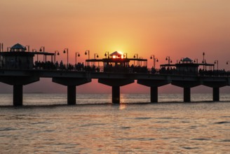 Sunset at the pier in Miedzyzdroje, Western Pomerania, Poland, East Europe, Europe
