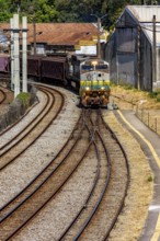 Train loaded with iron ore crossing the city in Minas Gerais, Brazil, Belo Horizonte, Minas Gerais,