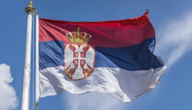 Flags, the national flag of Serbia flutters in the wind