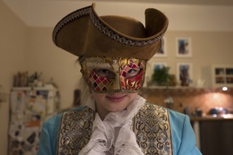 Girl, 10 years old, with carnival mask, Mecklenburg-Western Pomerania, Germany, Europe