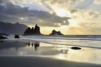 Dramatic clouds with rock formation at sunset on the beach of Playa de Benijo, Tenerife, Canary