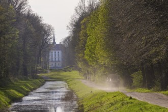 Canal between the hunting lodge and the Fasanenschlösschen with a carriage on a round trip,