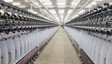 BENIN TEXTILE CORPORATION BENIN, Spun yarn is assembled on reels in a textile factory near Cotonou