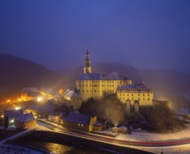 Winter evening in the Müglitz valley, impressively illuminated Weesenstein Castle at the blue hour,