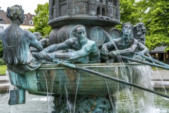 Detail of the historical column of the fountain on Josef-Görres-Platz in the historic centre of