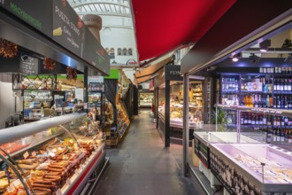 Various market stalls with delicatessen products from different nations in the Markthalle