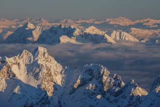 Mountain peak above high fog, evening light, winter, view from Zugspitze to Dreitorspitze and