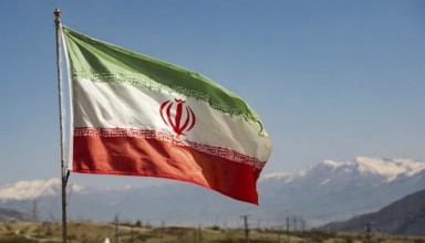 Flag, the national flag of Iran flutters in the wind