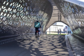 Light effects from the sun in the Parkbruk, a cycle and pedestrian bridge in the city centre of
