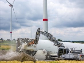 Demolished tower of a 20 year old wind turbine, in the Werl wind farm, 5 old Enercon E-66 turbines