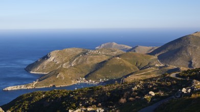 View of a picturesque coastline with mountains and the sea under a blue sky, southern tip, Mani