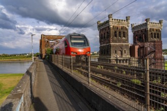 The railway bridge Duisburg-Hochfeld-Rheinhausen, over the Rhine, regional trains and many goods
