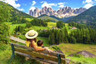 Mother and son enjoying a relaxing moment on a bench, admiring the breathtaking panorama of the