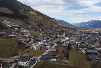Drone shot, view of village with parish church, Piesendorf, Pinzgau, Salzburg province, Austria,