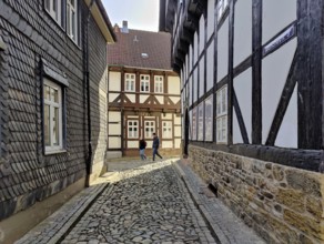 Narrow alley with half-timbered houses and cobblestones in the old town, UNESCO World Heritage