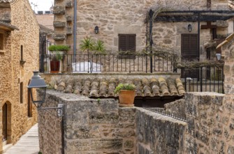 View of Mediterranean houses, roofs and courtyards from the town wall, Alcudia, Majorca, Spain,