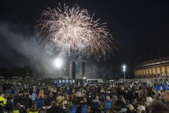 Spectators watch the fireworks at the Pyronale on the Maifeld at the Olympic Stadium, Berlin,