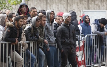 Refugees from Syria waiting to be registered at the Central Reception Centre for Asylum Seekers at