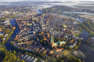 Aerial view over the river Trave and old town and churches of the Hanseatic City of Lübeck in the