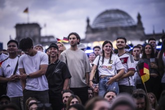 Scenes in the fan zone on Platz der Republik in front of the Reichstag building taken in Berlin, 29