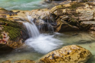 The Riss creek flowing through an autumnal landscape in the Eng valley
