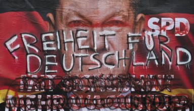 Denigration of a large poster for the 2025 federal election by the SPD with Olaf Scholz, Witten,