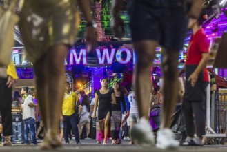 Crowds of people on Bangla Street in the evening. Nightlife on Bangla Walking Street with go-go