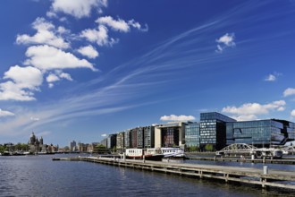 Booking com headquarters, at the back Basilica of St Nicholas (Dutch: Sint-Nicolaasbasiliek), Roman