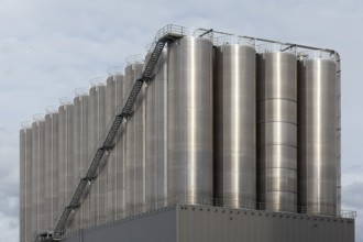 High silo facility for bulk goods, aluminium silo with external staircase, Parallelhafen,