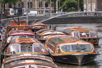 Canal cruises, pier of Lovers Canal Cruises, at Amsterdam Centraal station, Amsterdam Netherlands