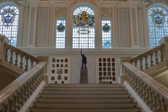 Elegant interior with majestic staircase, statue and stained glass windows, Belfast