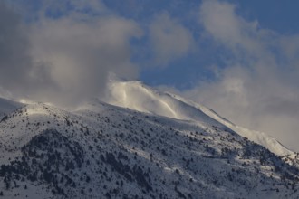 Snow-covered mountain peaks under a blue sky with few clouds, Lefka Ori, White Mountains, mountain
