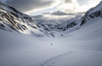 Lonely ski tourers, Snowy mountain landscape, Bernese Alps, Bernese Oberland, Switzerland, Europe