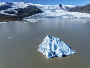 Aerial view over the glacial lake Fjallsárlón, glacier Fjallsjökull, part of Vatnajökull glacier,