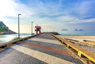 Breakwater pier on Barra da Tijuca beach in Rio de Janeiro at dawn Rio de Janeiro, RJ, Brazil,