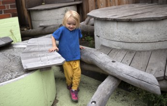 Little girl, 3 years, blonde, balancing, gymnastics, playing, adventure playground, playground,