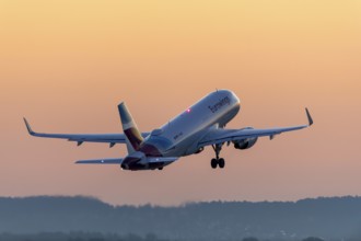 Passenger aircraft after take-off, in front of sunrise, Baden-Württemberg, Germany, Europe