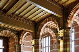 Interior view of Centraal Station, Central Station with flag, Amsterdam, Netherlands
