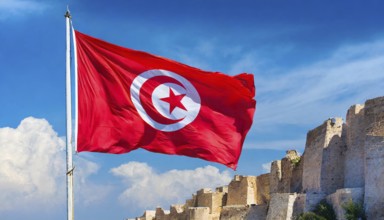 Flags, the national flag of Tunisia flutters in the wind