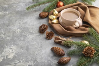 Christmas or New Year composition. Decorations, cones, cinnamon, fir and spruce branches, cup of