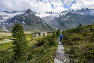 Mountaineer barefoot on a hiking trail, mountain hut Berliner Hütte, mountain peak Steinmandl,